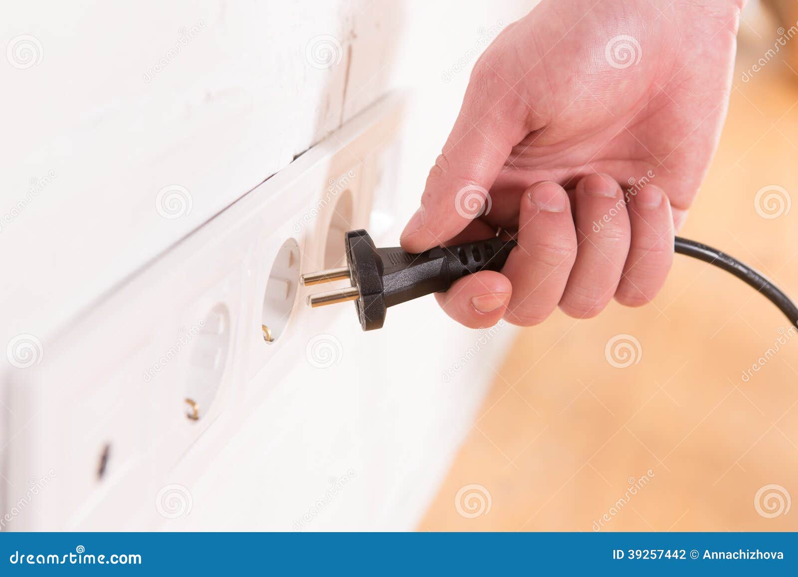 pull-the-plug-concept-with-man-pulling-black-cord-and-plug-stock-photo