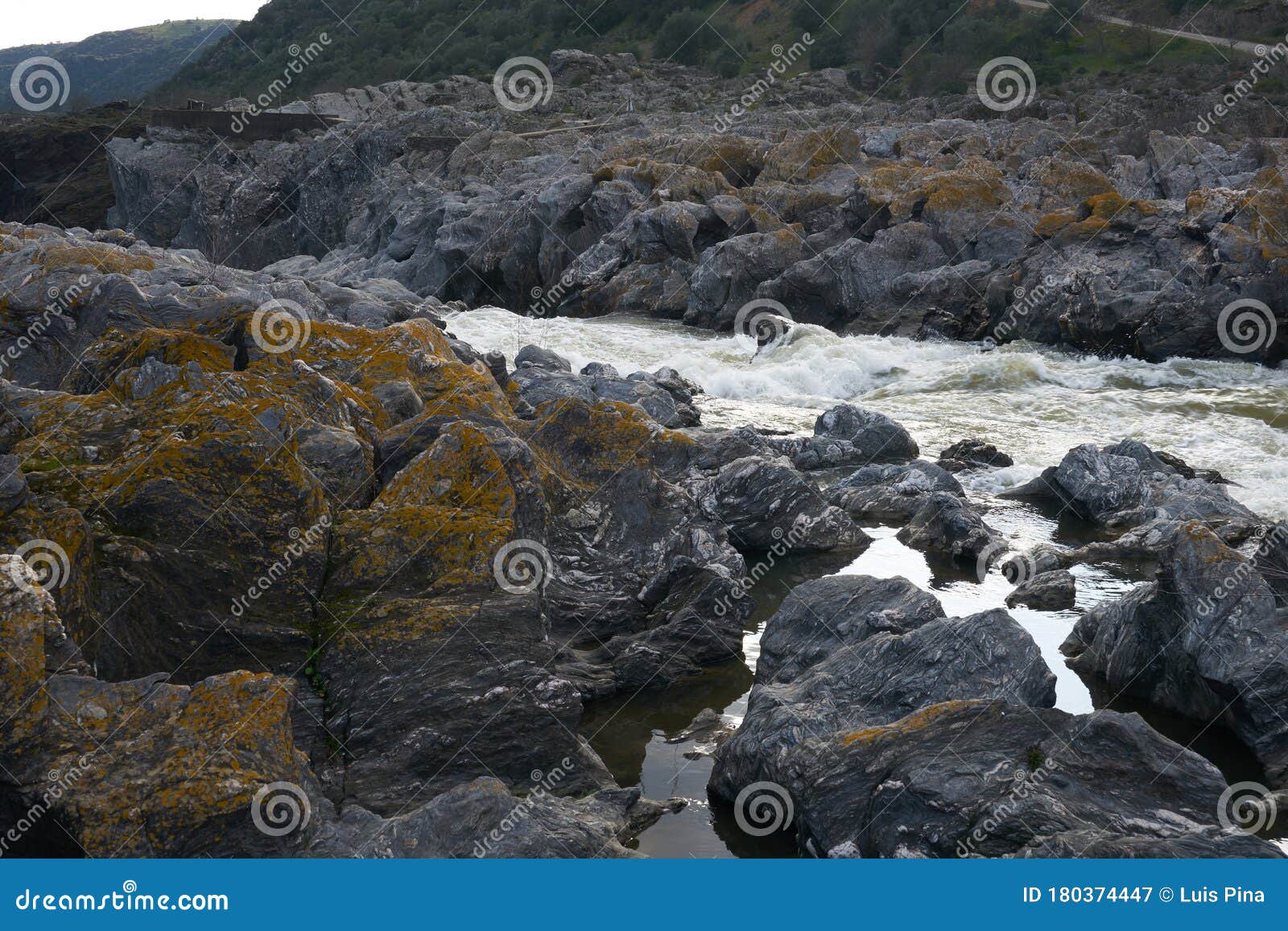 pulo do lobo waterfall with river guadiana and rock details in mertola alentejo, portugal