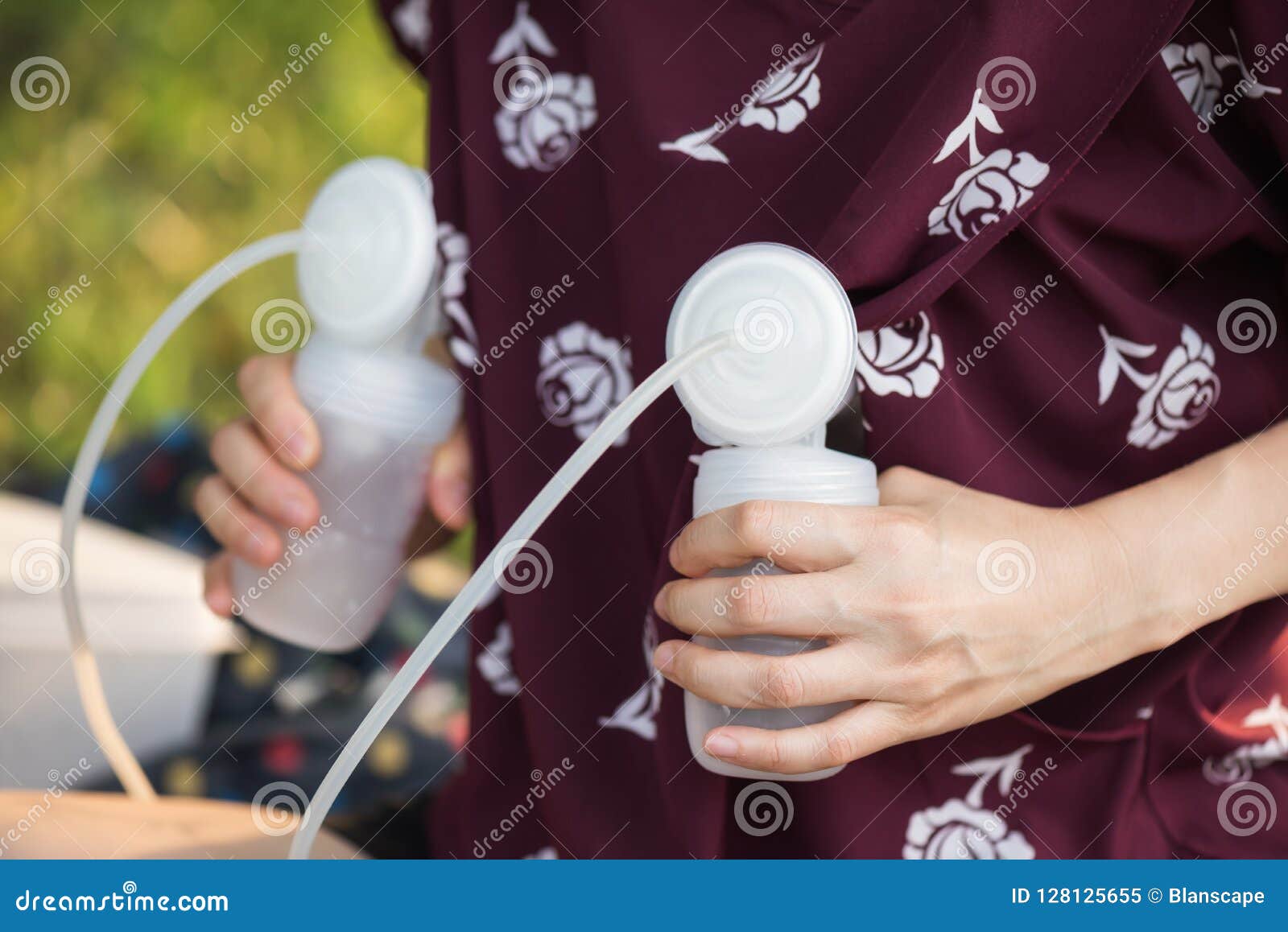 Pump Breast Milk With Bokeh Foliage Background Stock Image I