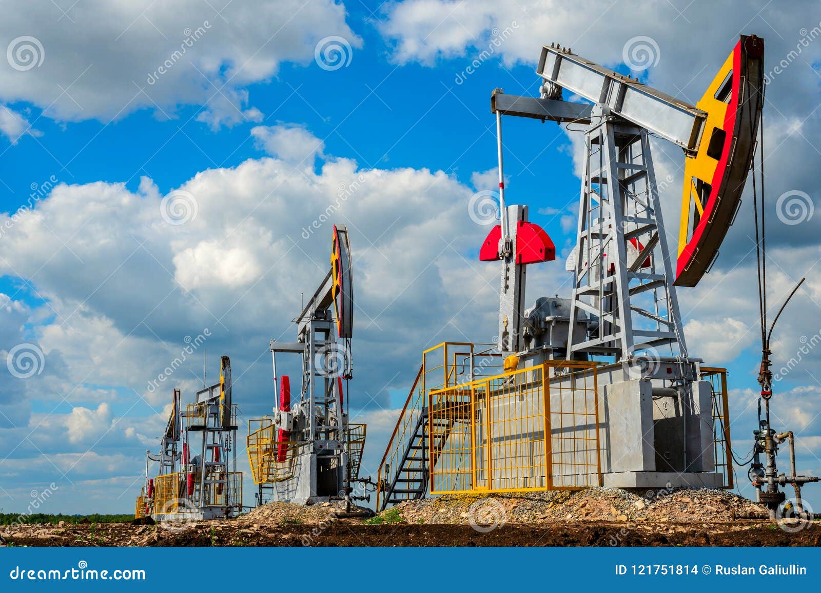 pumping stations for oil and natural gas production against the cloud sky