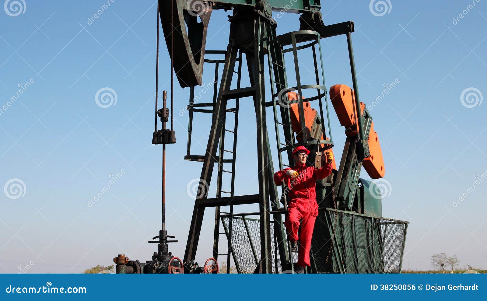 Pumpjack and Oilfield Worker. Stock Photo Image of metal, industrial 38250056