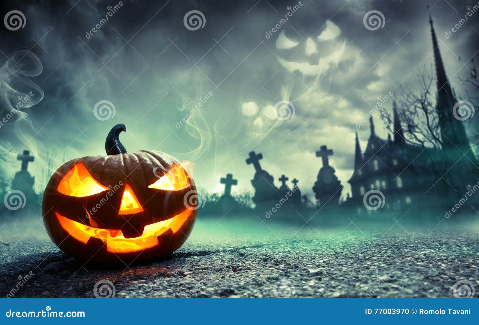 pumpkin burning in a graveyard with ghost