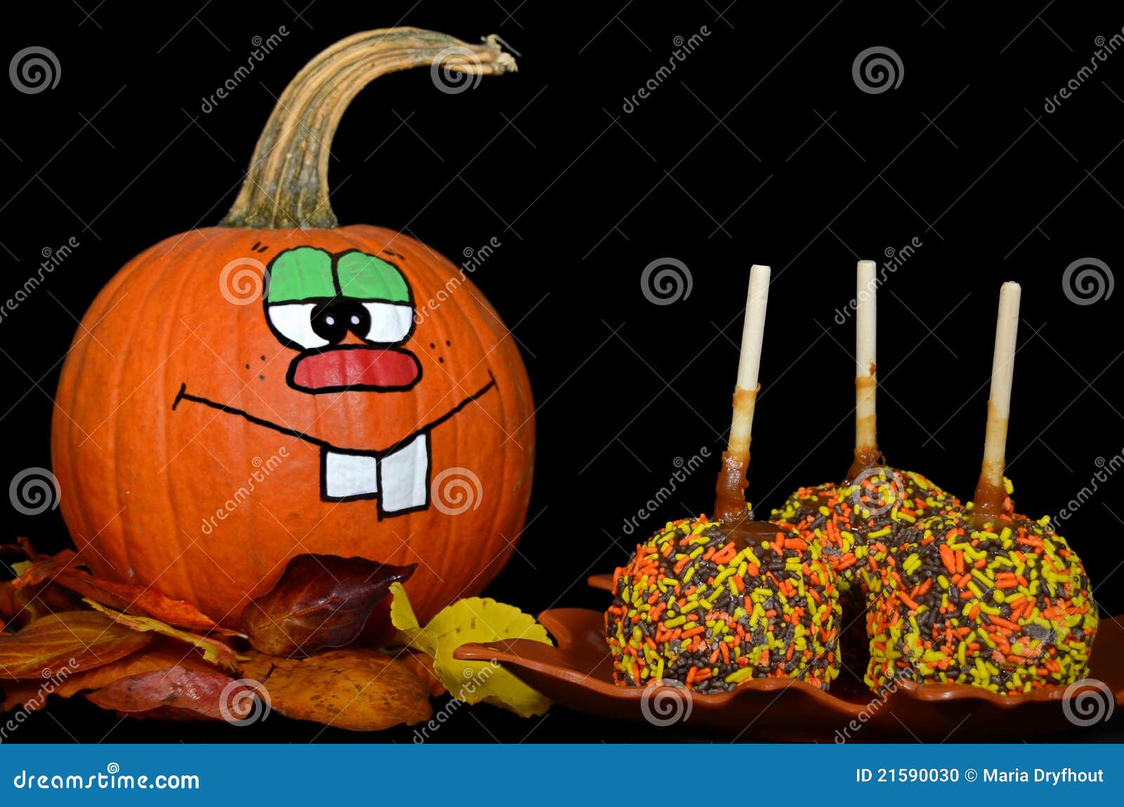 Pumpkin with caramel apple stock photo. Image of humor - 21590030