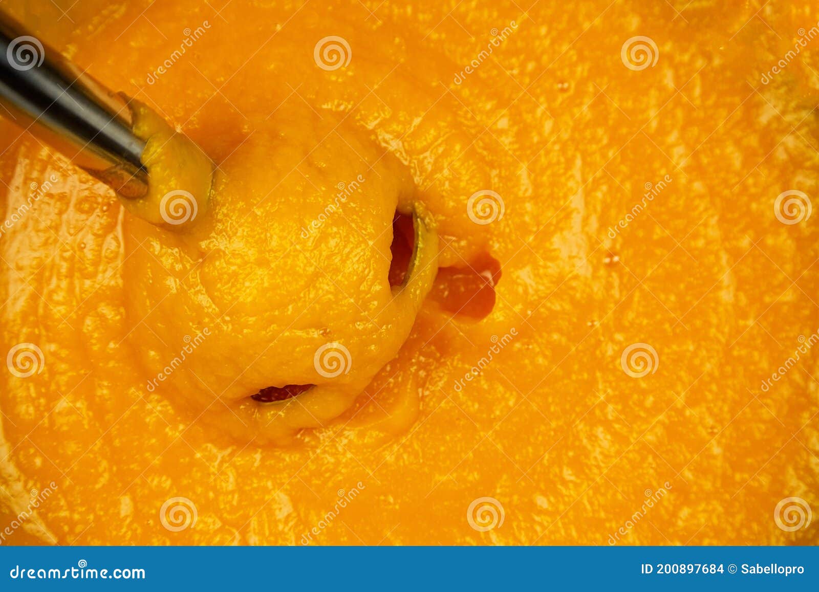 pumpkin puree with blender, closeup. cooking mashed pumpkin