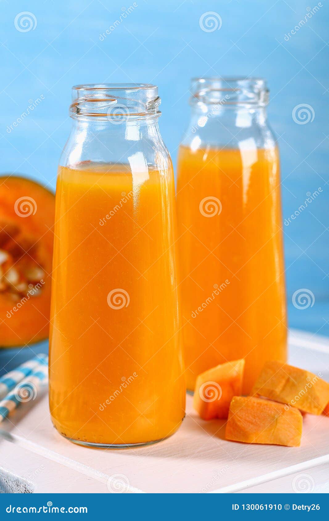Pumpkin Smoothie Bottled. Pumpkin Juice on a Blue Table. Autumn Drinks