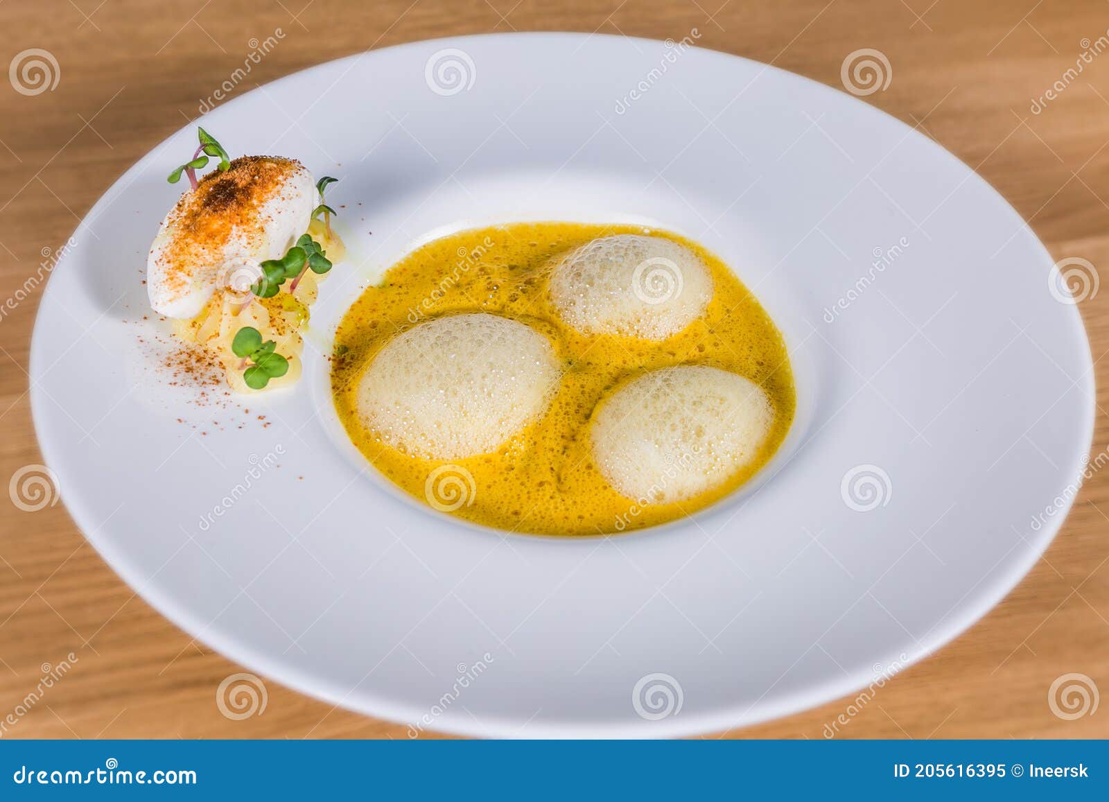 pumpkin soup with espuma and herbs