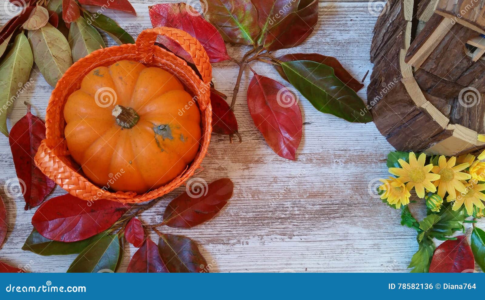 Pumpkin, Wooden Cabin and Autumn Leaves on Old Wooden Background Stock ...