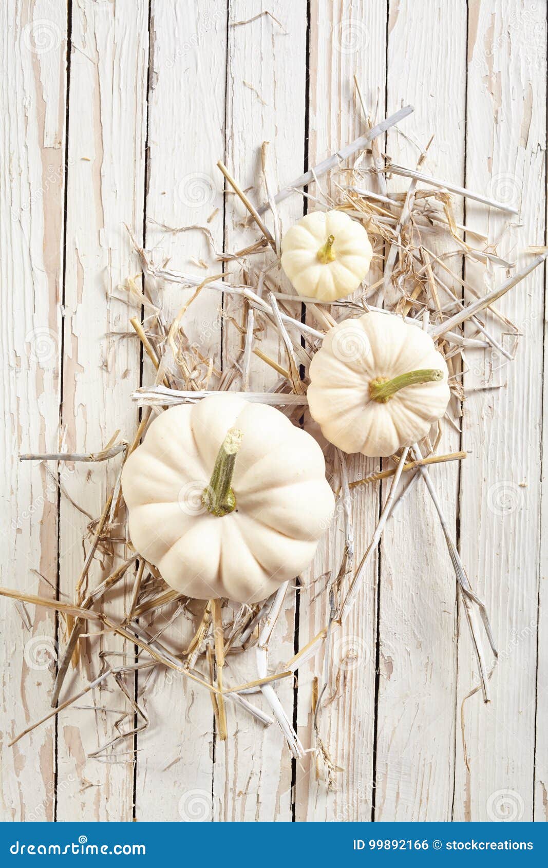 Pumpkins with Straw Against Wooden Background Stock Photo - Image of