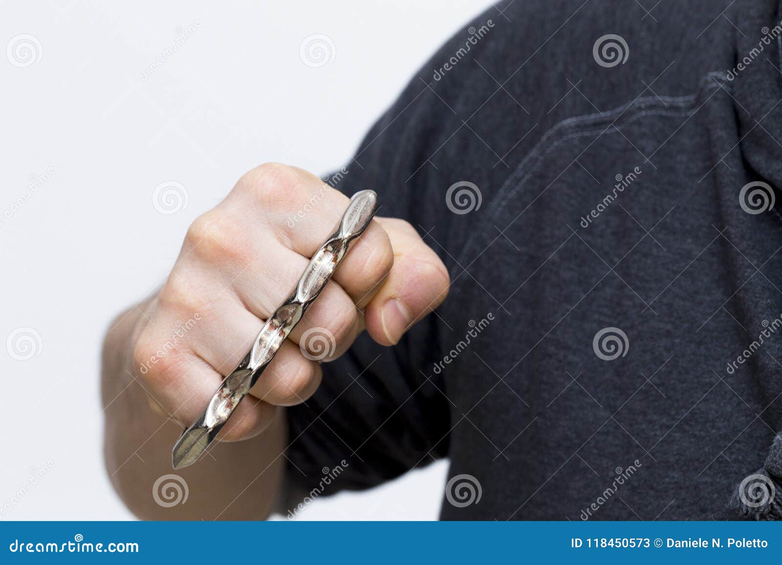 A Punch with Brass Knuckles Stock Image - Image of hand, brass