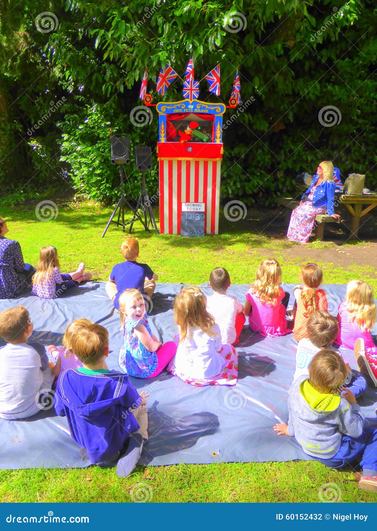 Puppet show on grass lawn editorial photography. Image of show 60152432