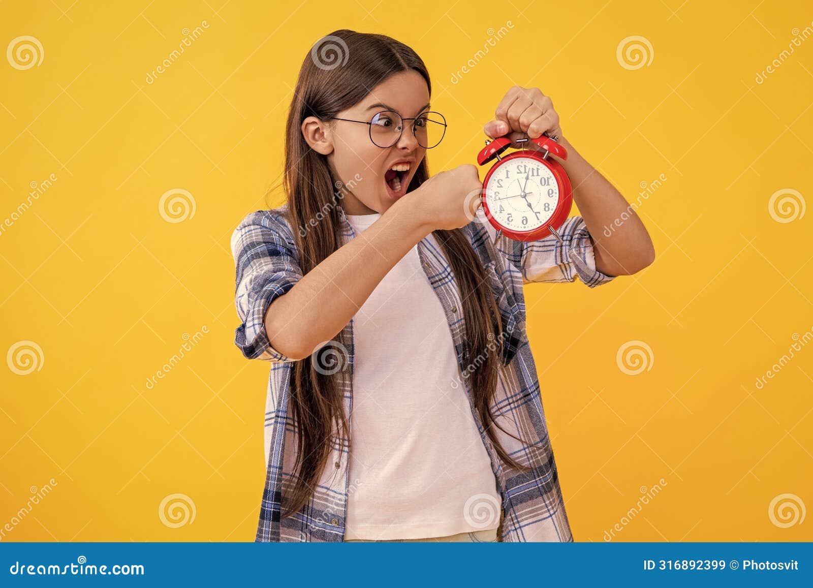 punctuality in early morning time. school time schedule. teen girl with alarm clock. time ticking for a busy teen girl