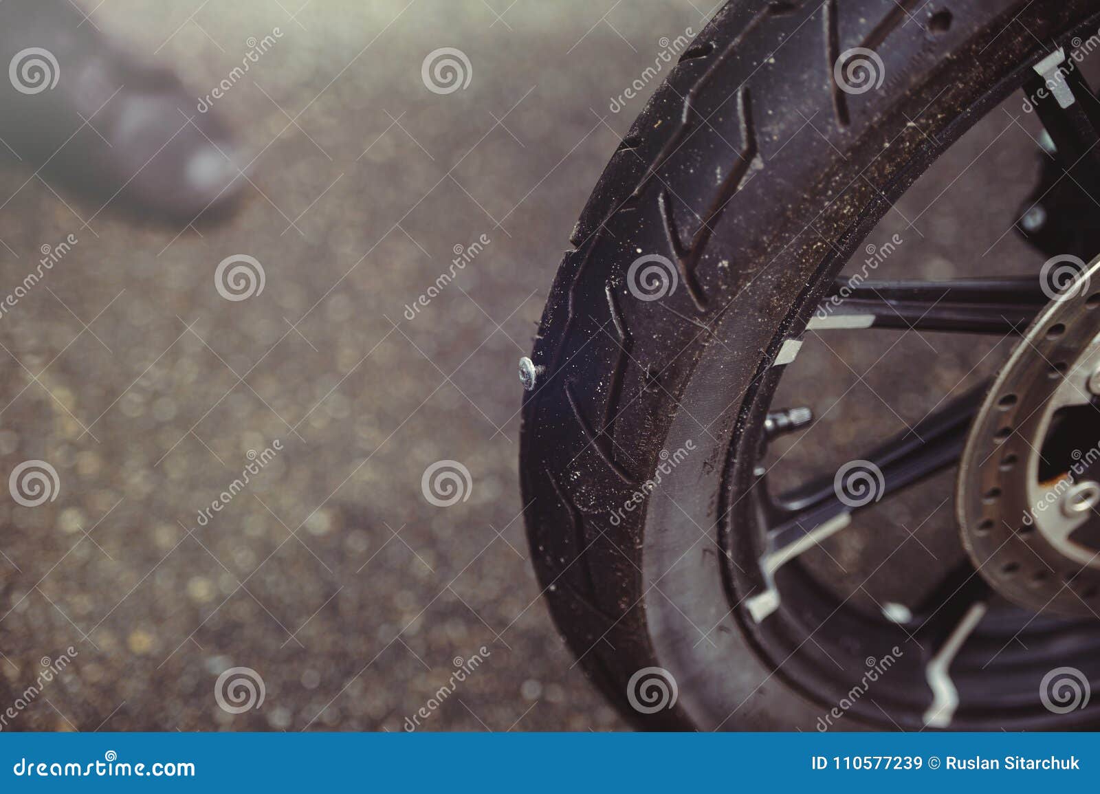 Punctured Motorcycle Wheel, a Nail Sticks Out of the Tire, Tire Fitting