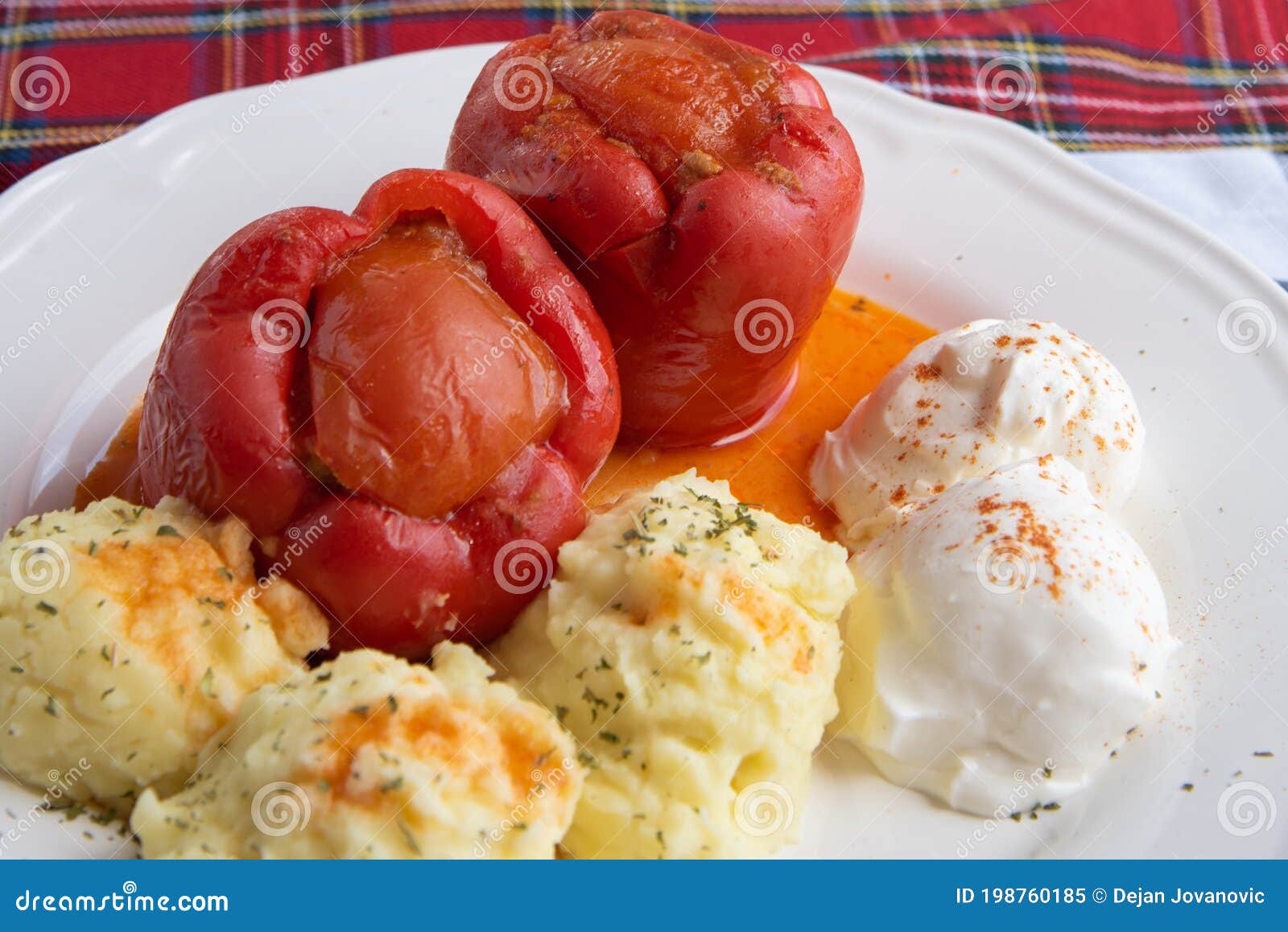 stuffed peppers plate served with mashed potatoes and cream cheese called kajmak