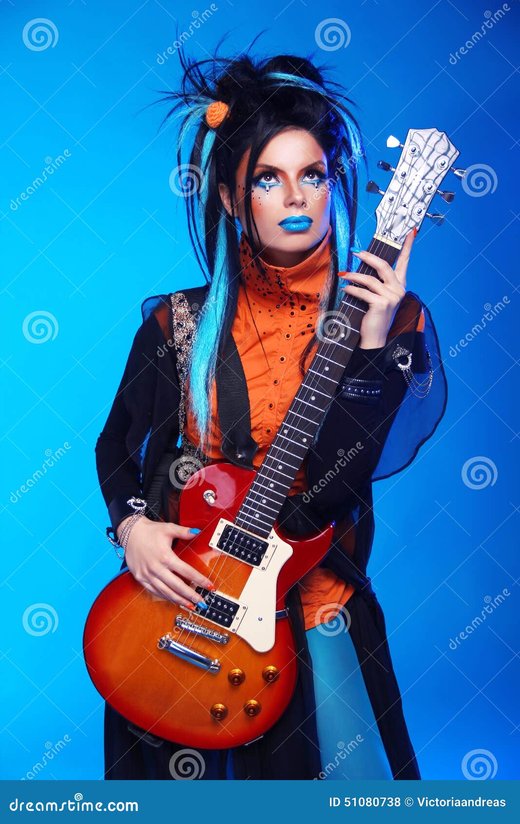 Punk Rock Girl Guitarist Posing Over Blue Studio Background. Trendy Model  with Hairstyle Stock Photo - Image of full, hair: 51080738