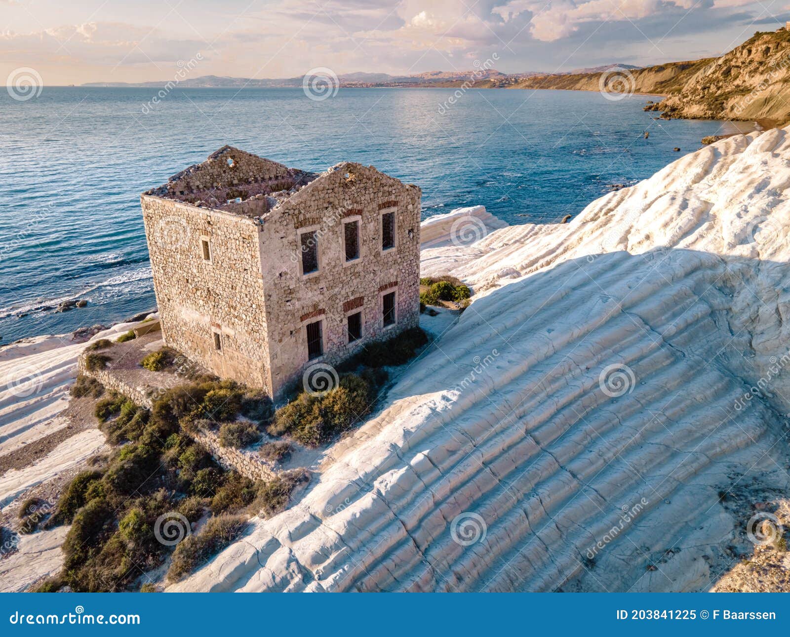 punta bianca, agrigento in sicily italy white beach with old ruins of abandoned stone house on white cliffs