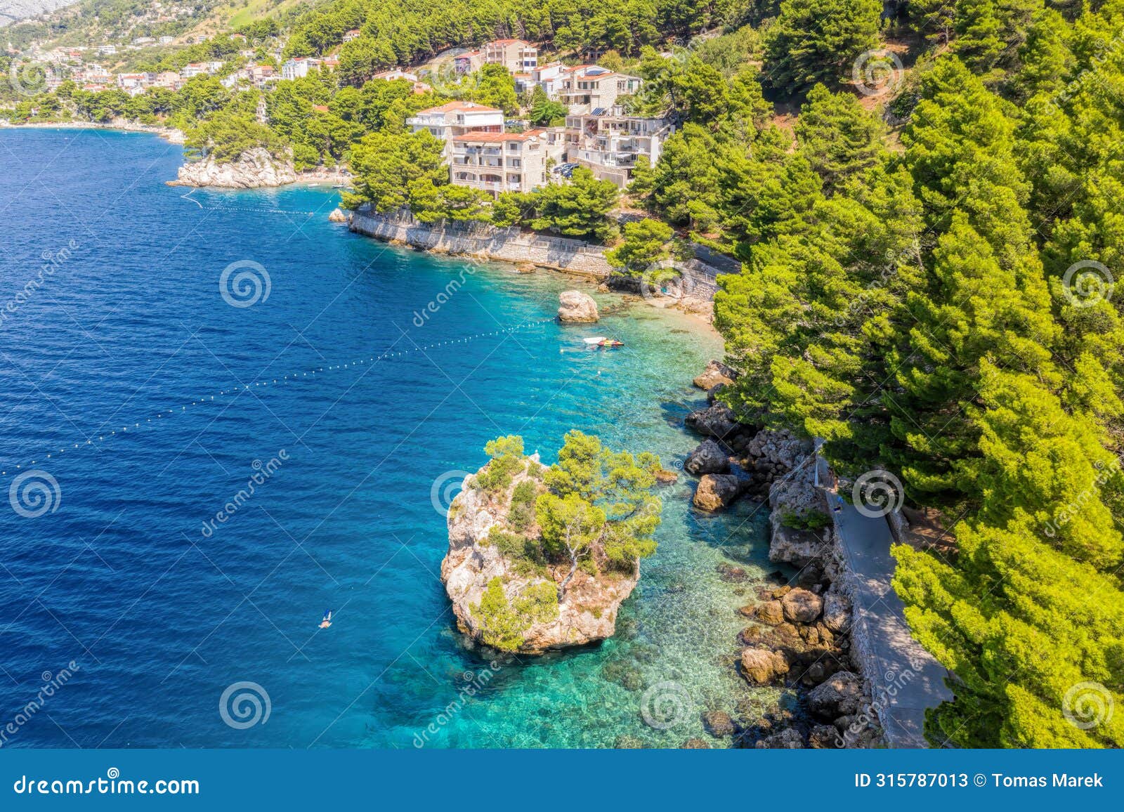 punta rata beach in brela, croatia, aerial view. adriatic sea with turquoise clean water and white sand on the beach