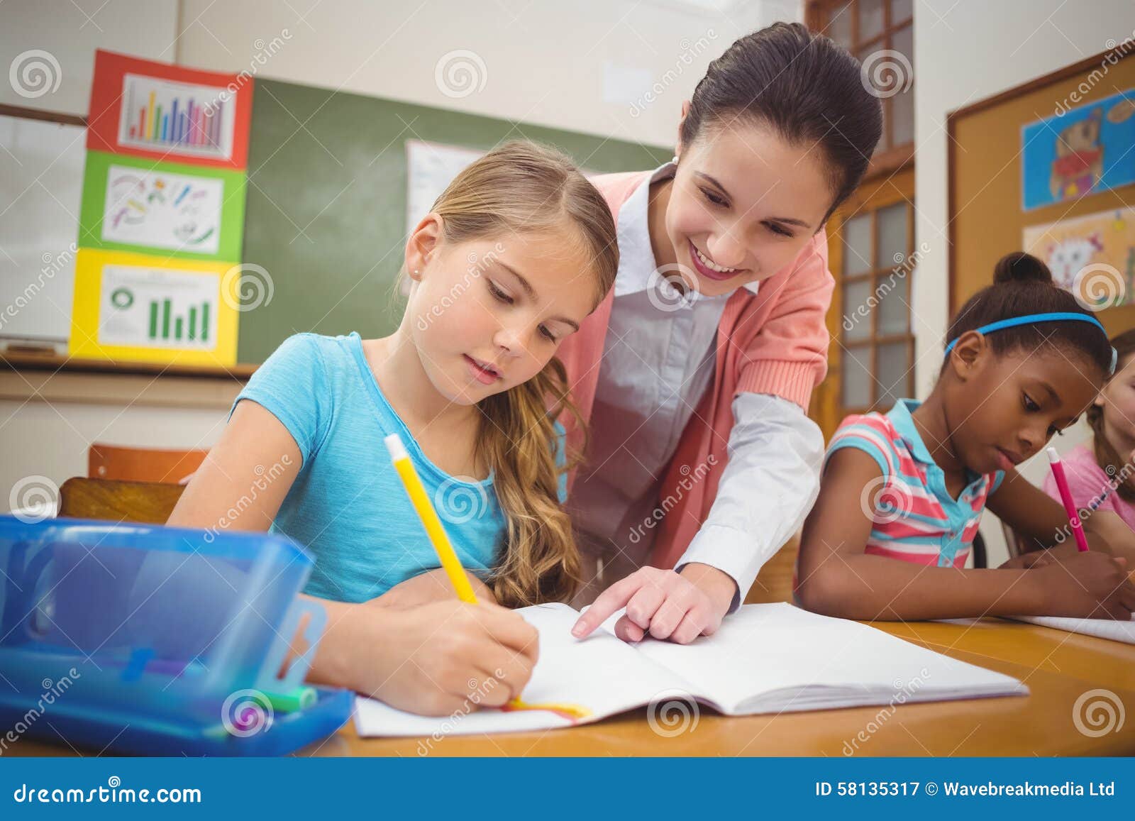 Pupil and Teacher at Desk in Classroom Stock Image Image of chair