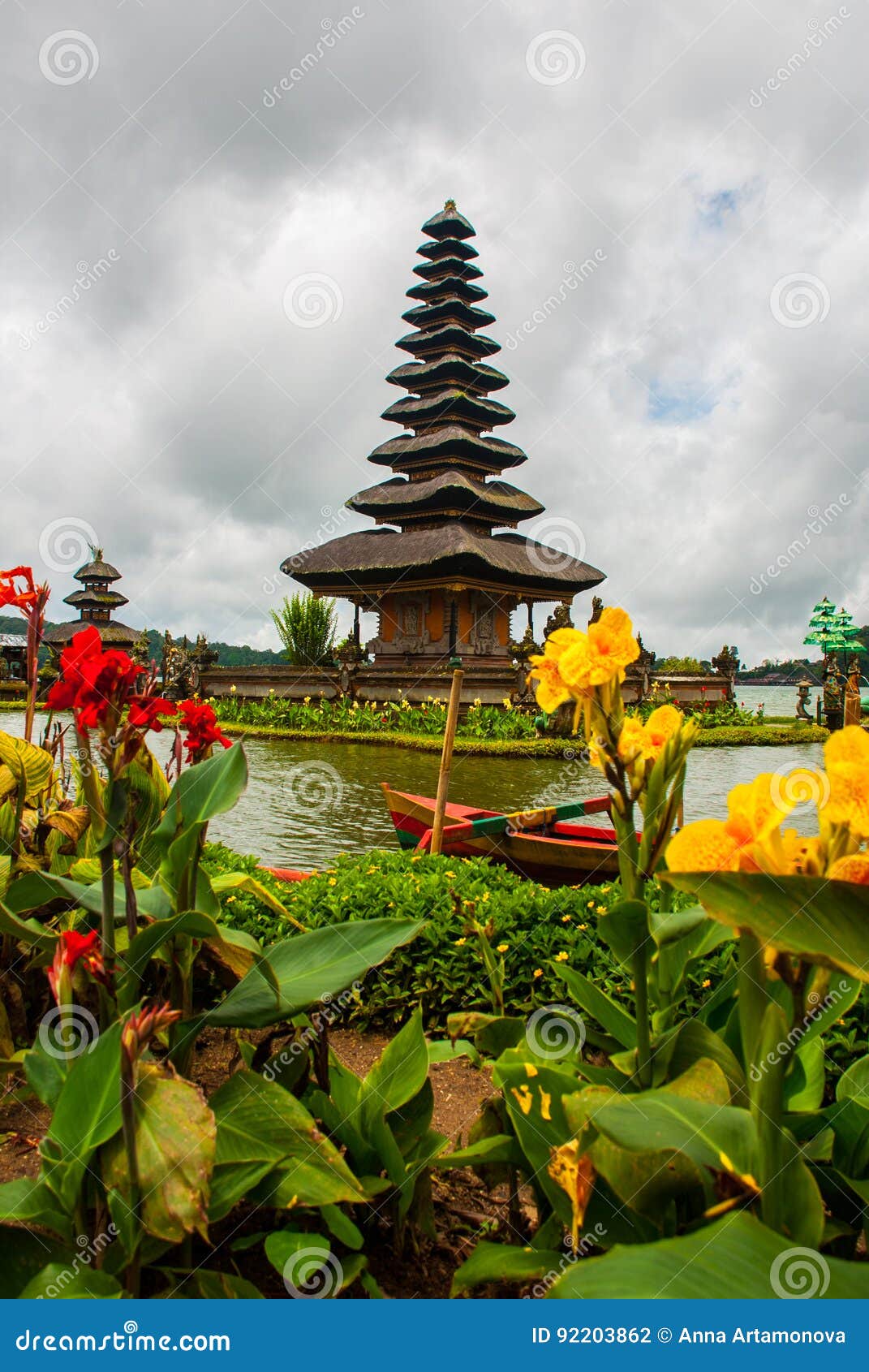 pura ulun danu batur temple in lake with flowers. bali, indonesia.