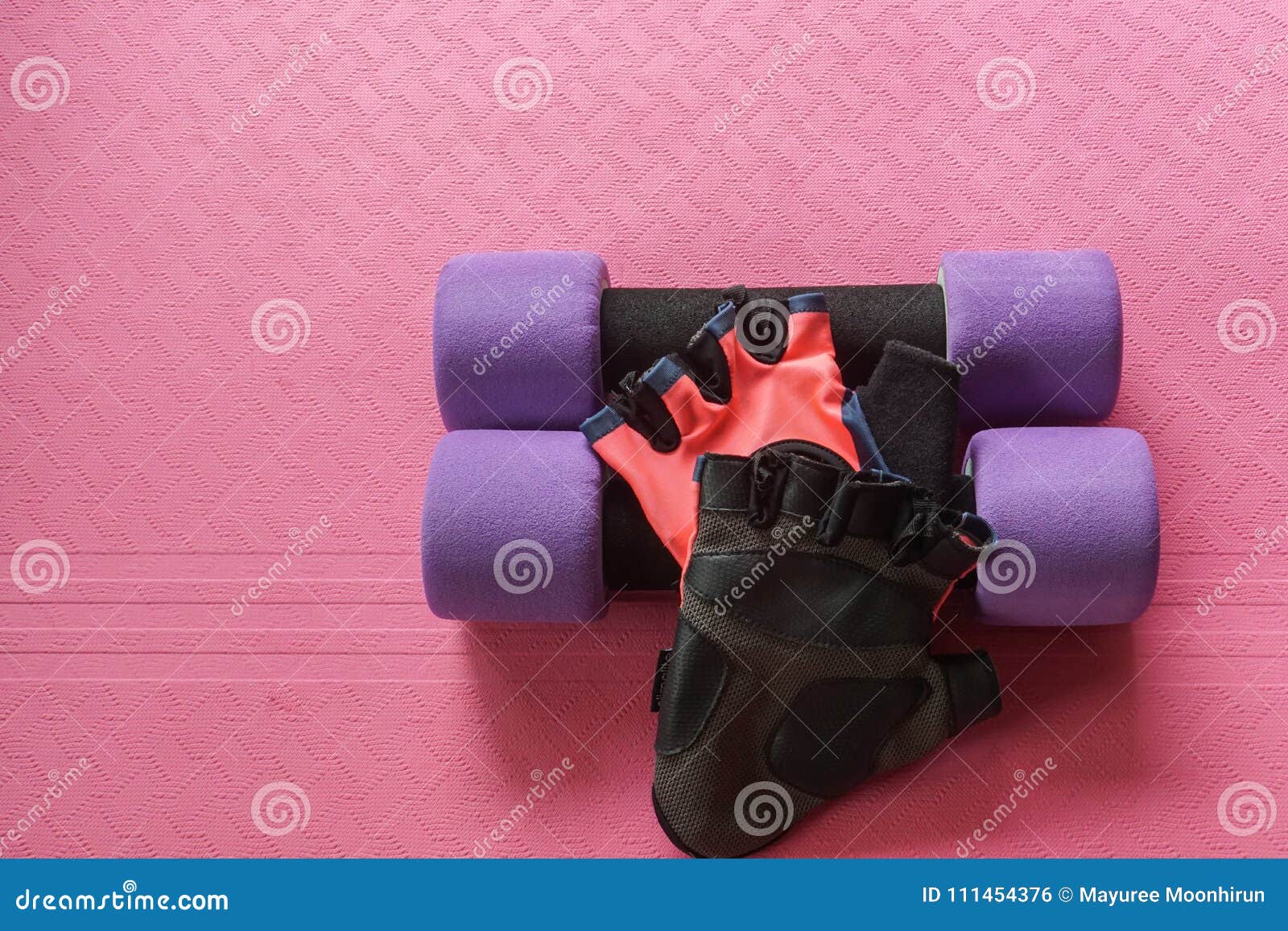 Purple Dumbbell with Women Fitness Gloves on Yoga Mat for Exercise ...