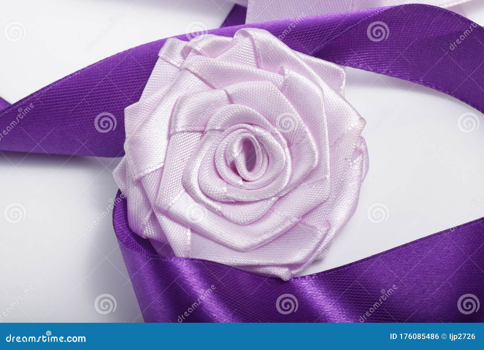 purple flower broche that made of satin ribbon