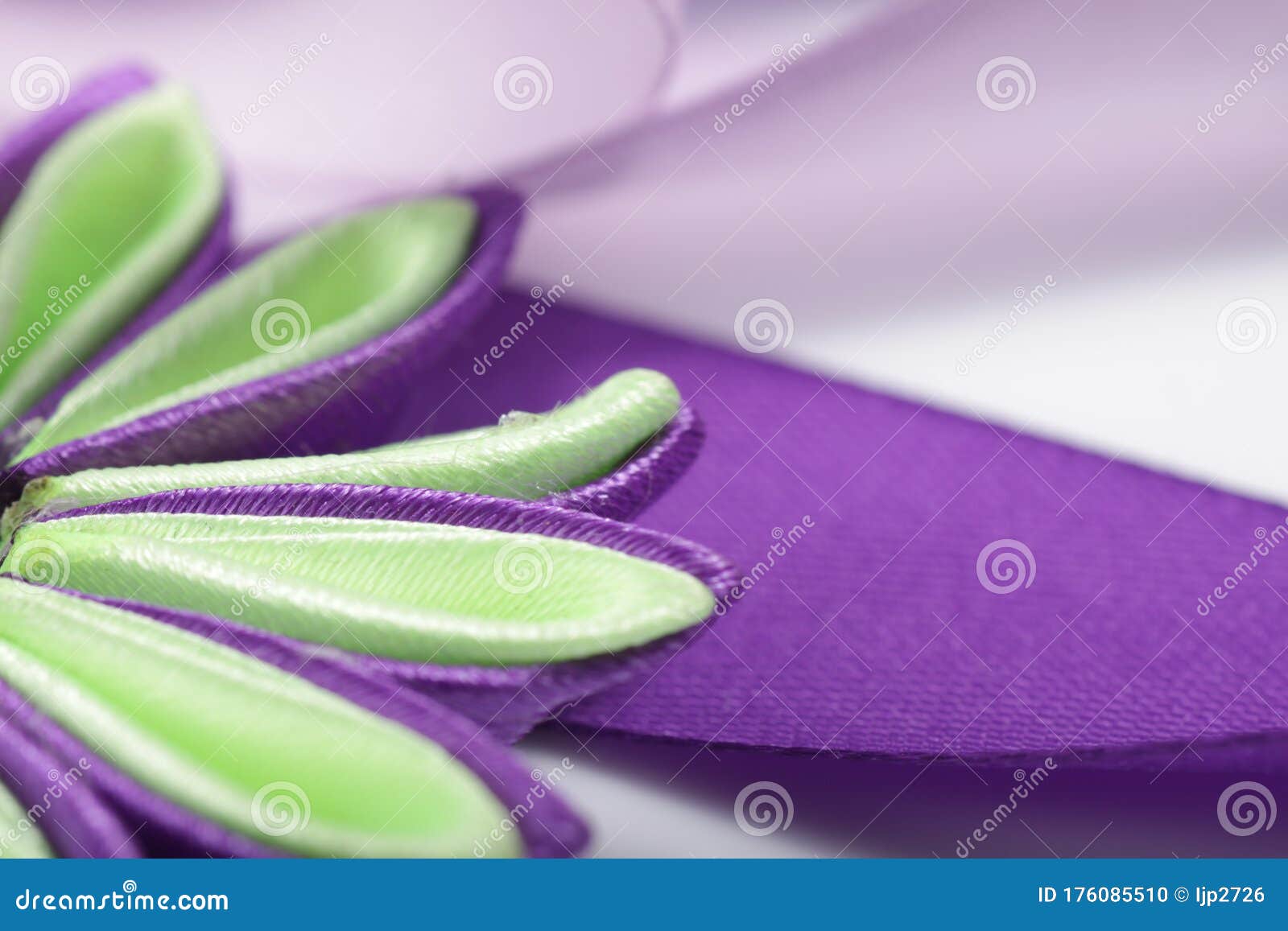 purple flower broche that made of satin ribbon