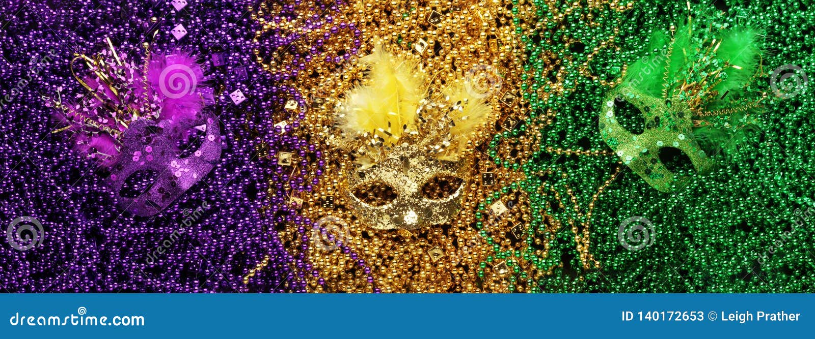 purple, gold, and green mardi gras beads and masks