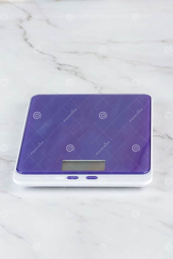 Purple Kitchen Scale on the Kitchen Table. Stock Photo Image of