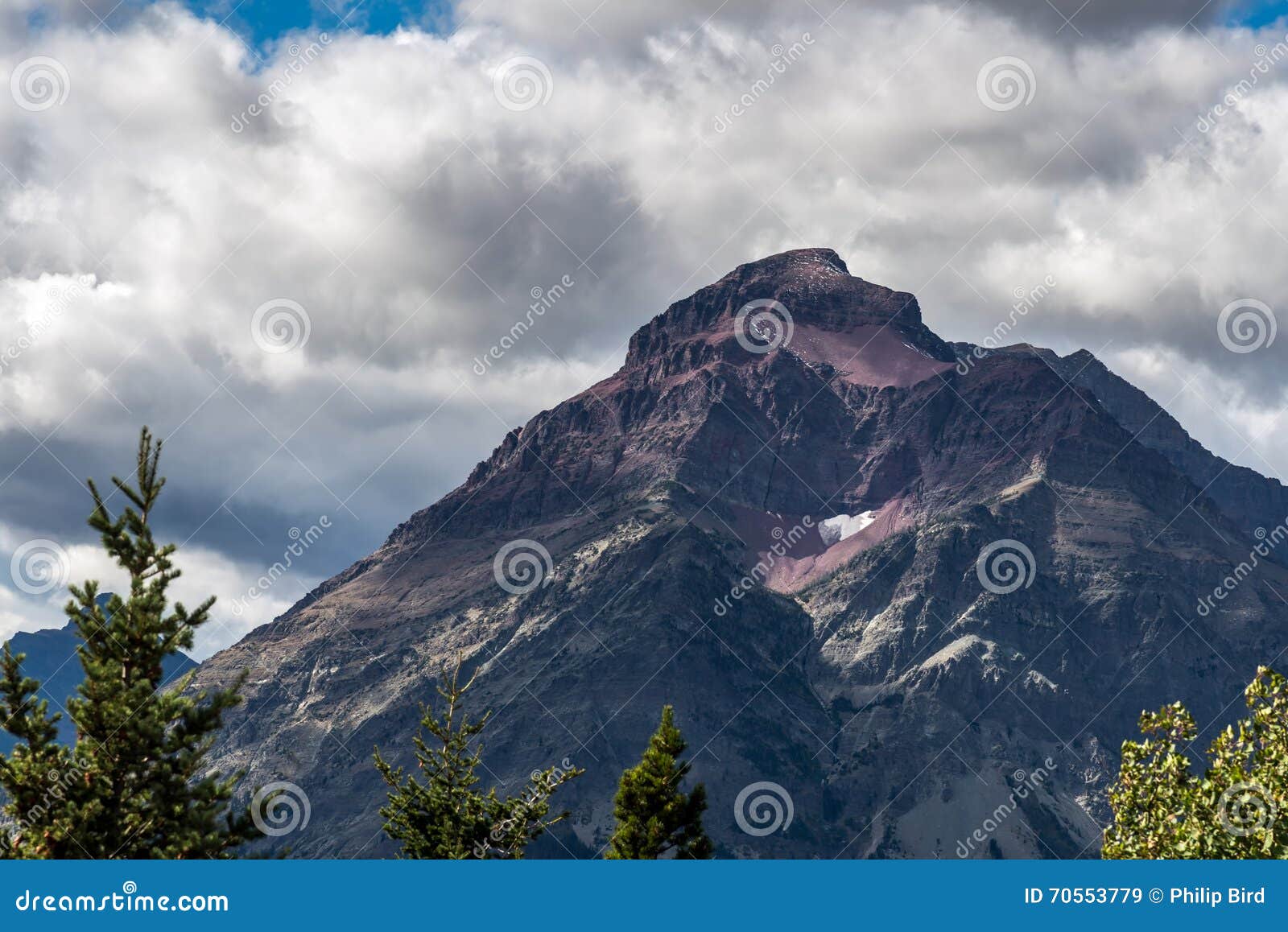 purple mountain next to lower two medicine lake