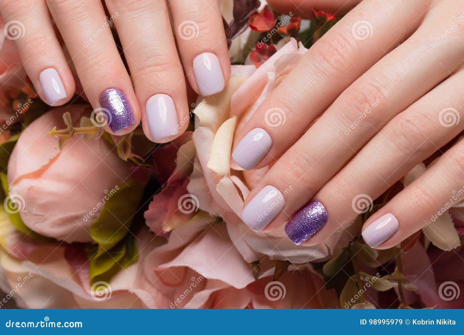 Purple Neat Manicure on Female Hands on Flowers Background. Nail Design ...