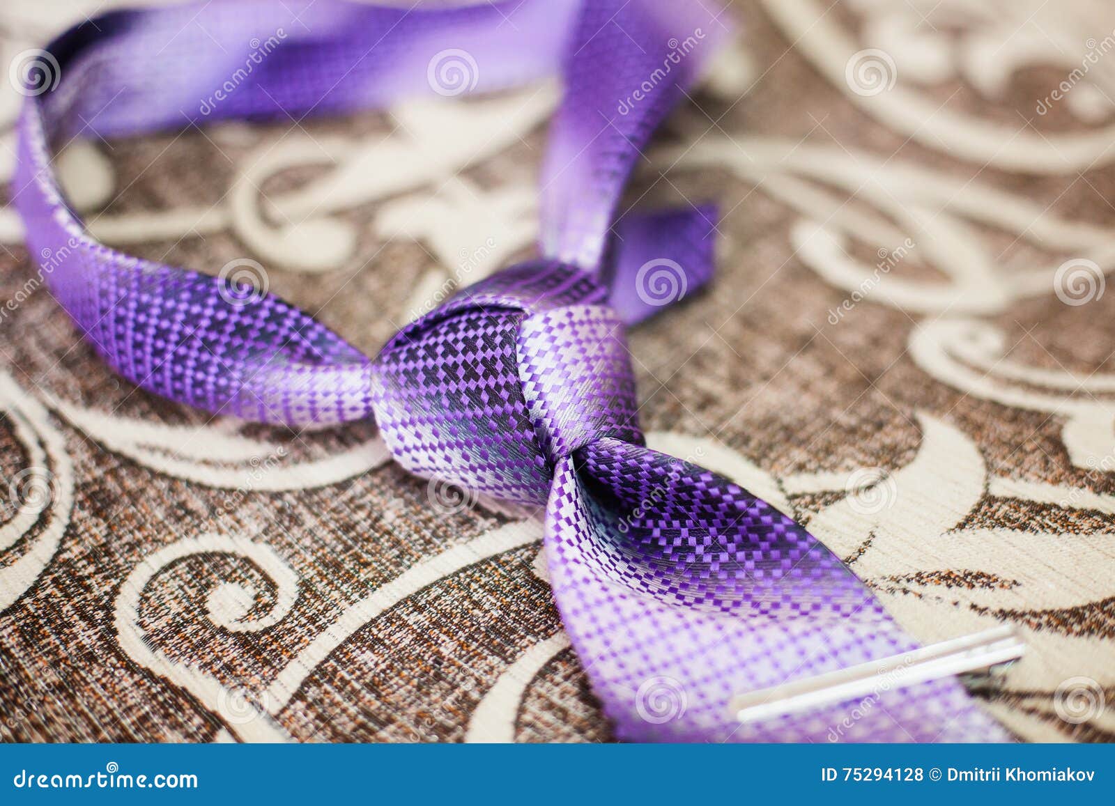 Purple Necktie with Trinity Tie Knot on a Sofa, Closeup Stock Photo ...