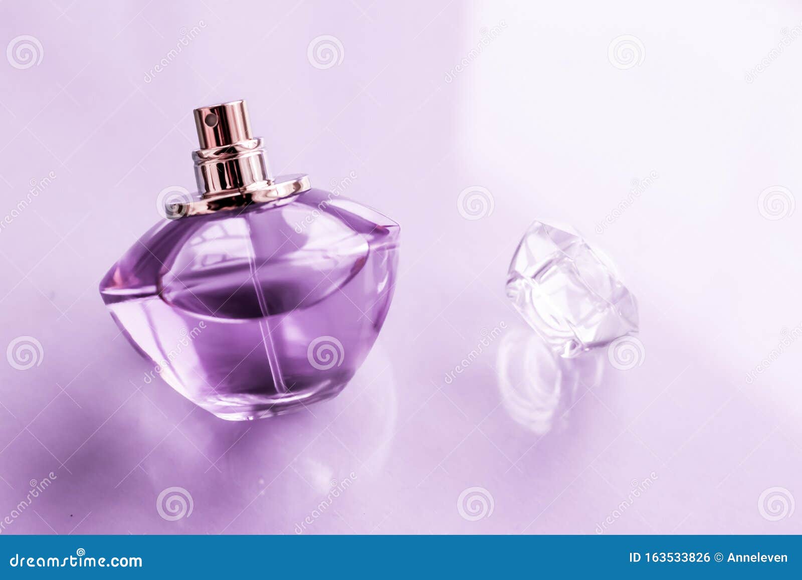Purple Perfume Bottle On Glossy 