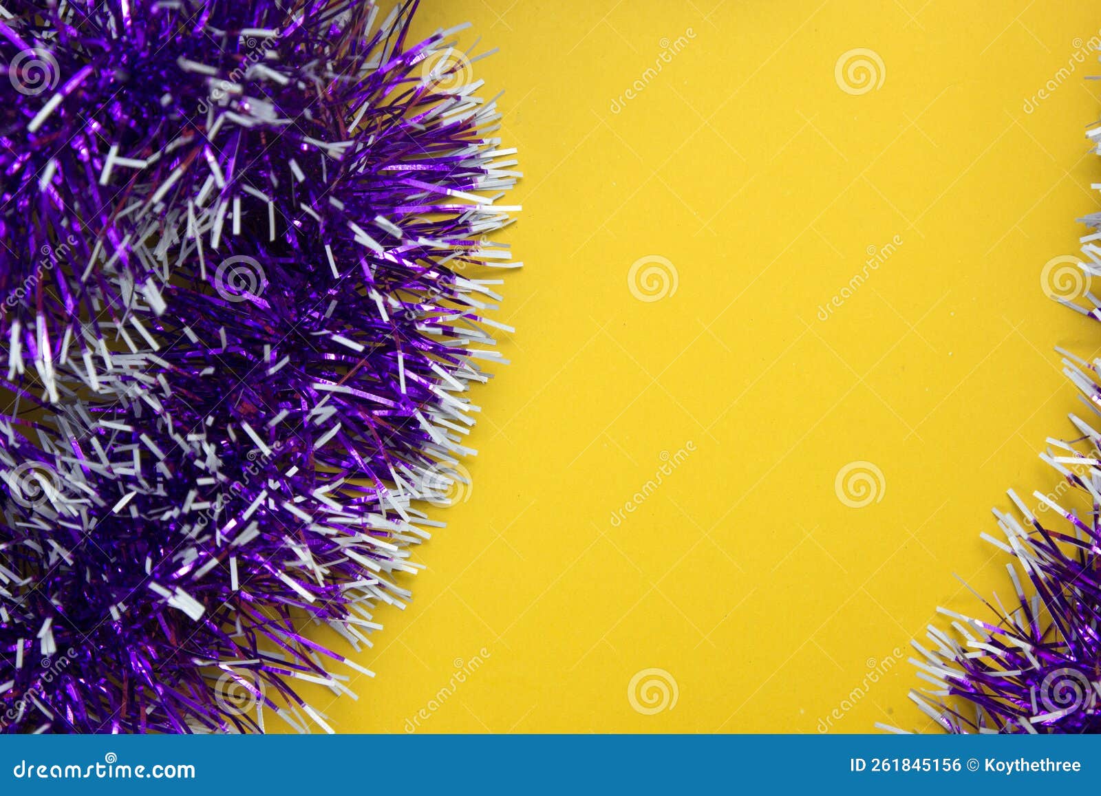 purple ribbons on yellow background and space for text, ribbons for gifts giving concept on christmas, newe year party decorection