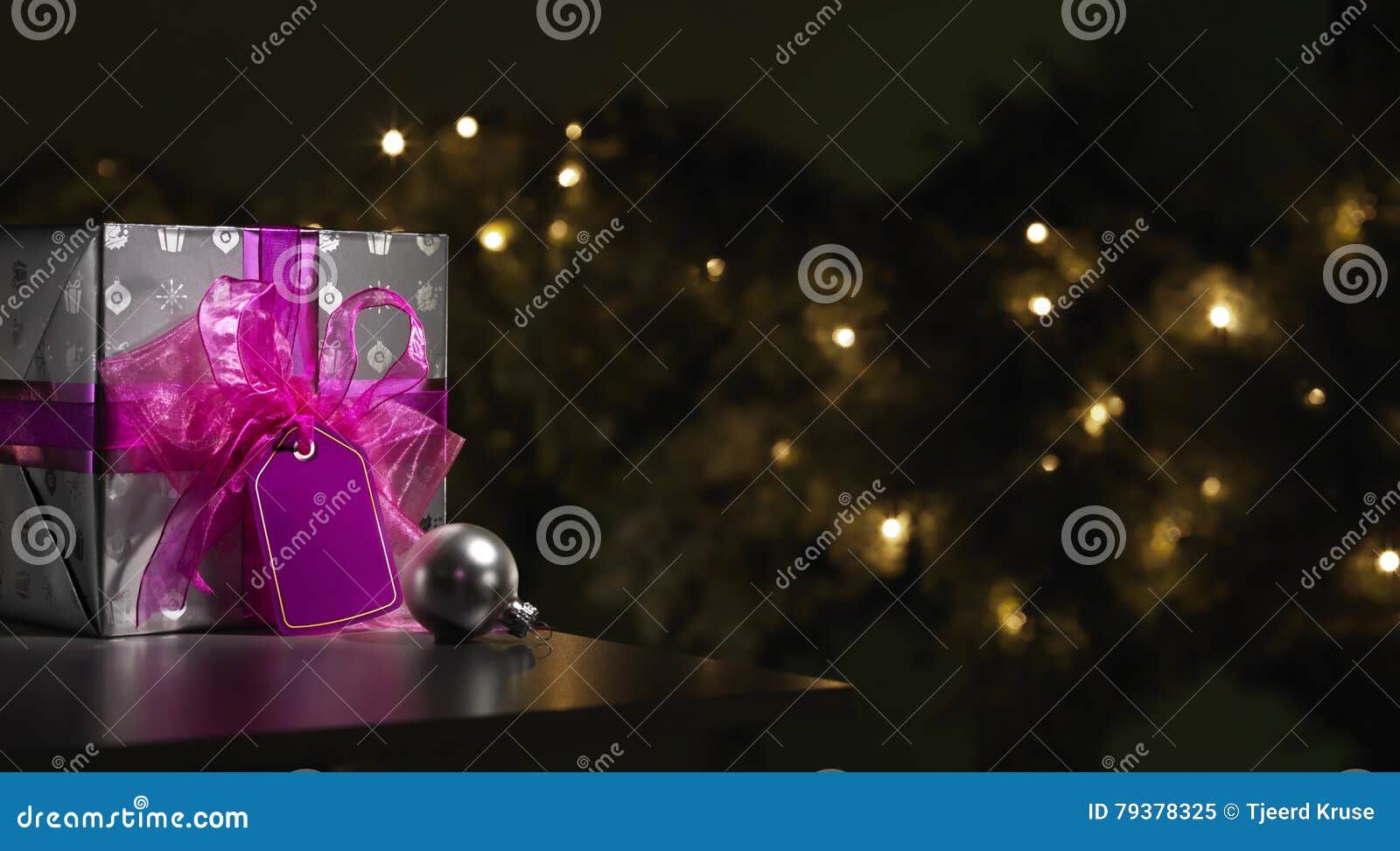 Purple and Silver Wrapped Christmas Present with Tree Stock Image ...