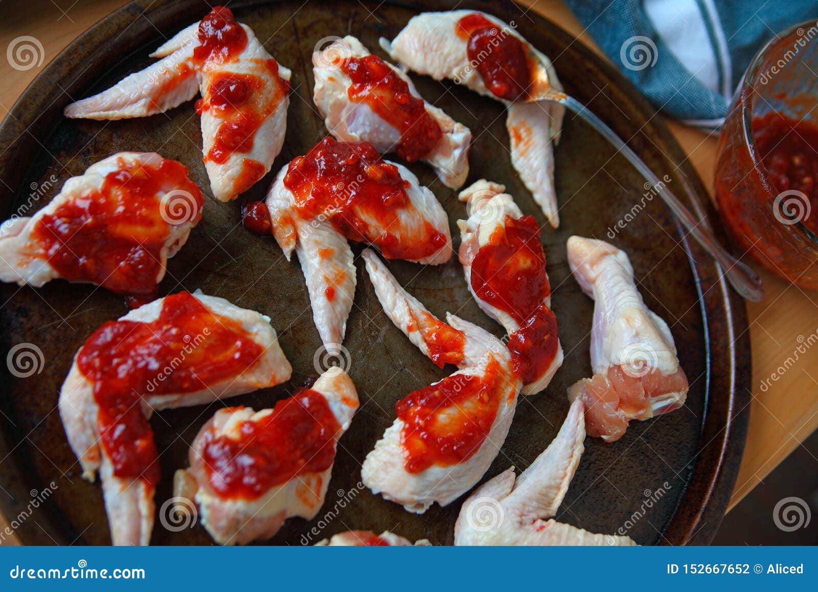 Putting Barbecue Sauce on Chicken Wings Stock Photo Image of spoon, game 152667652