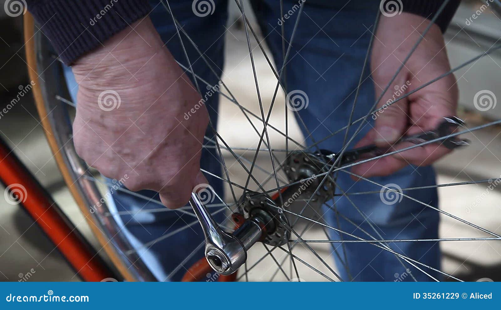 Putting bike wheel back on stock footage. Video of frame 35261229