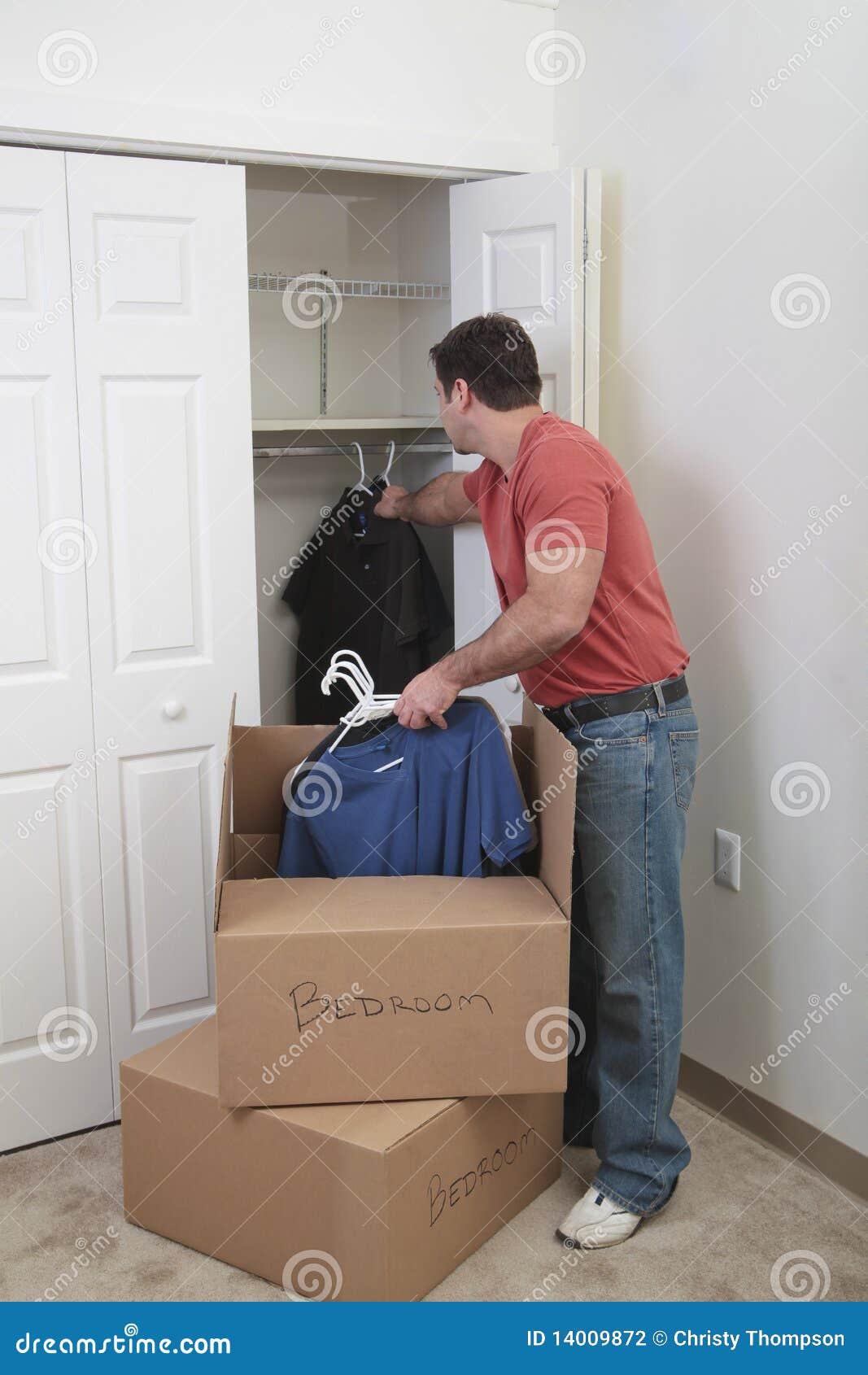 Putting the clothes away stock photo. Image of apartment 14009872
