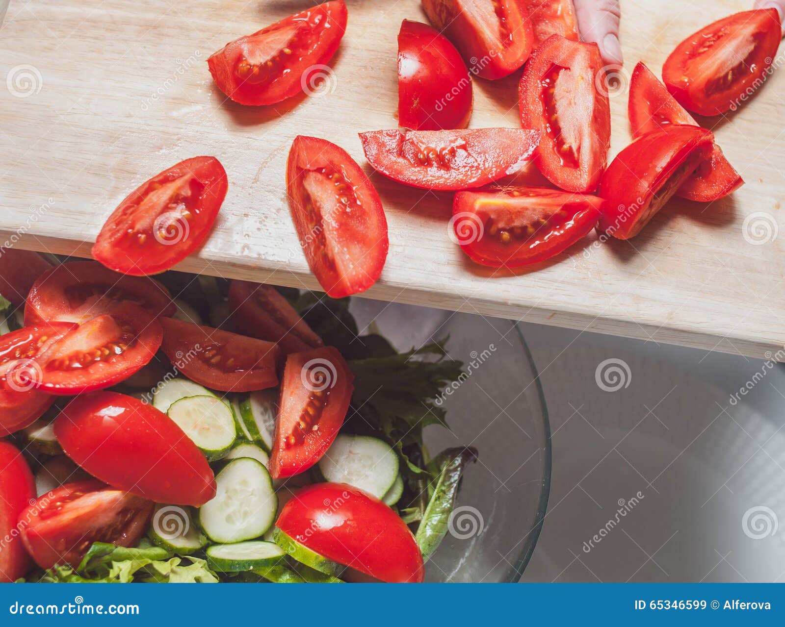 Putting Delicious Cut Tomatoes in the Salad Stock Image Image of
