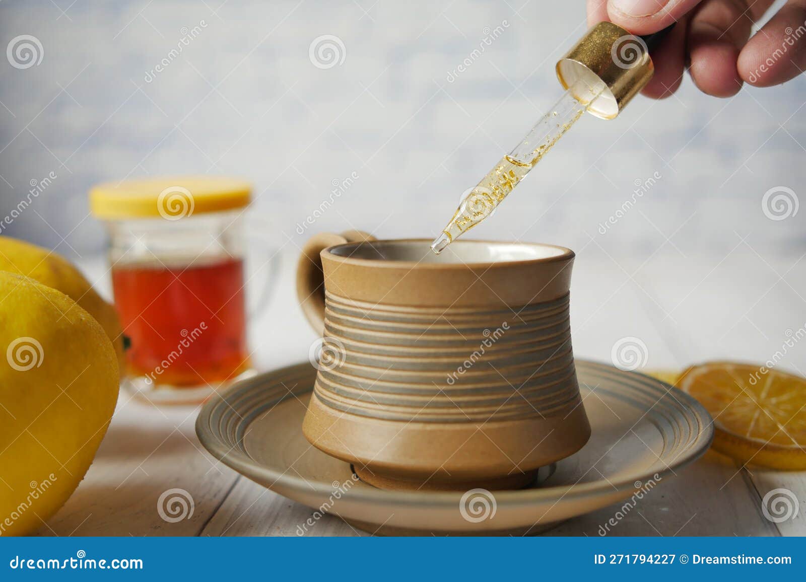 Putting Eucalyptus Essential Oils in Cup of Tea . Stock Image Image