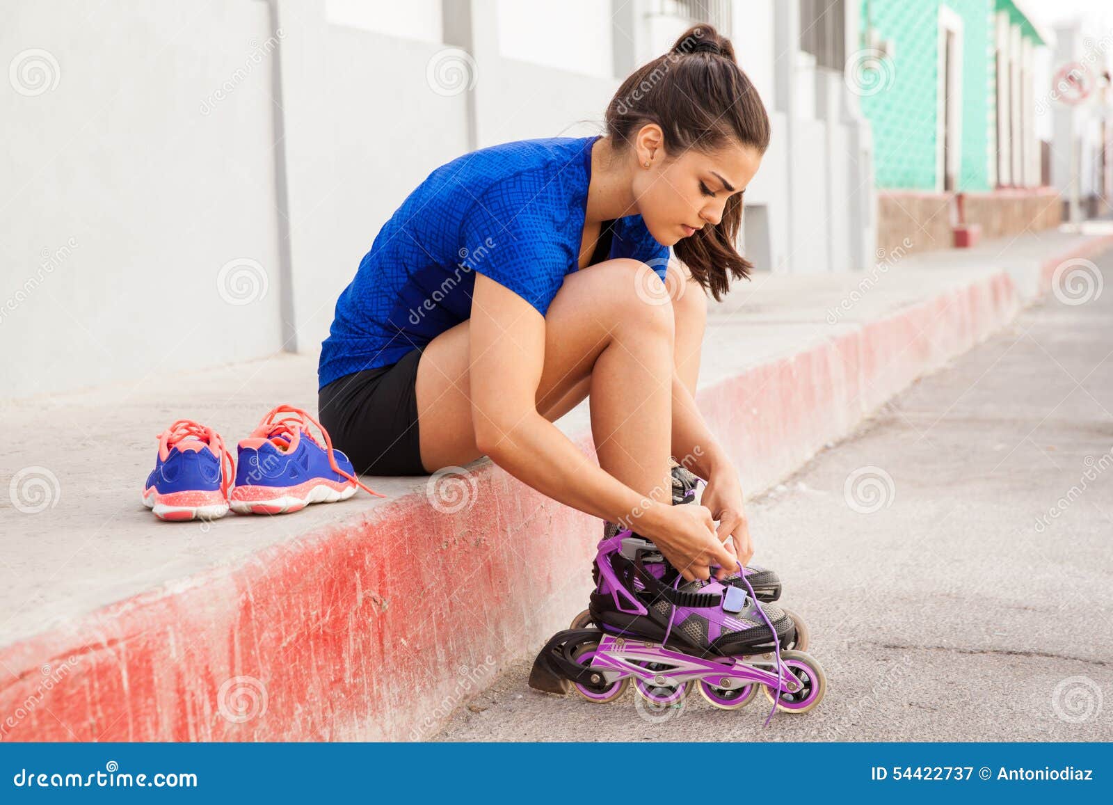 Putting inline skates on stock image. Image of skates 54422737