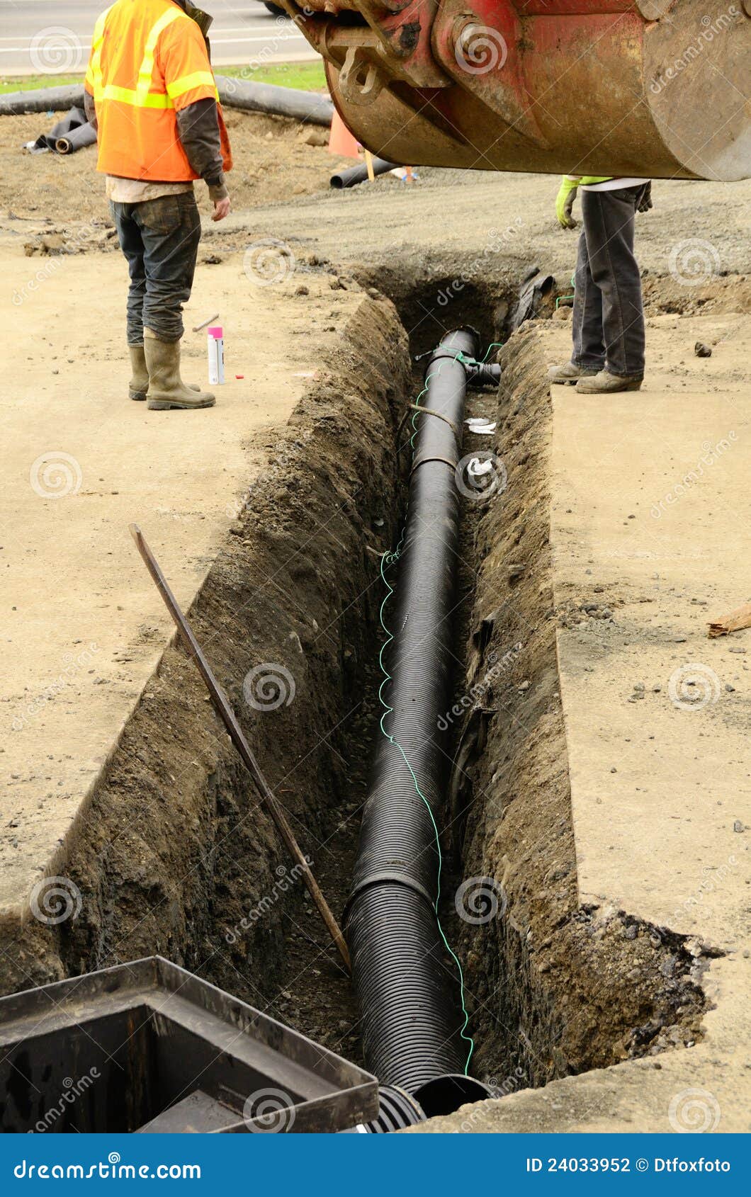 Putting in the Pipe stock photo. Image of contractor 24033952