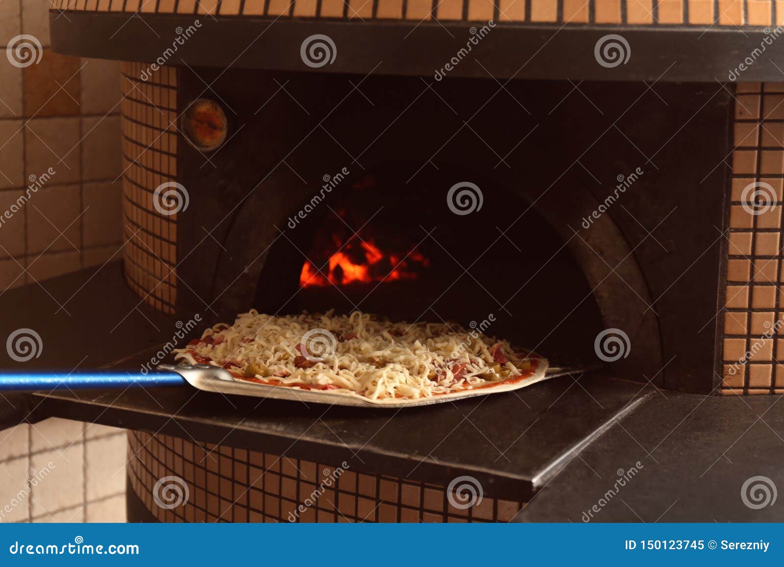 Putting of Pizza into Oven in Restaurant Kitchen Stock Image Image of