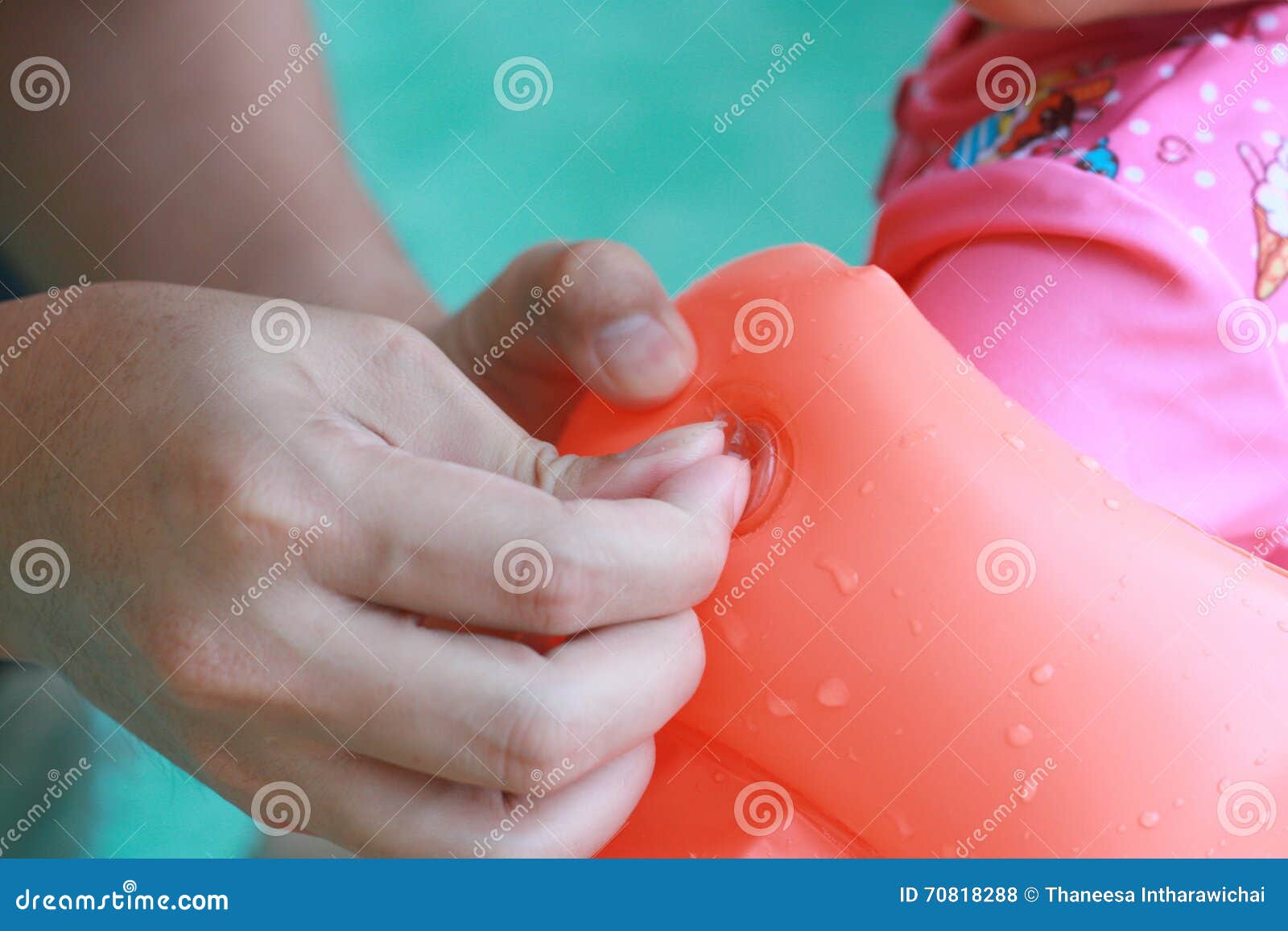 Putting Swimming Ring Arm Float for Kid, with Daylight Stock Photo