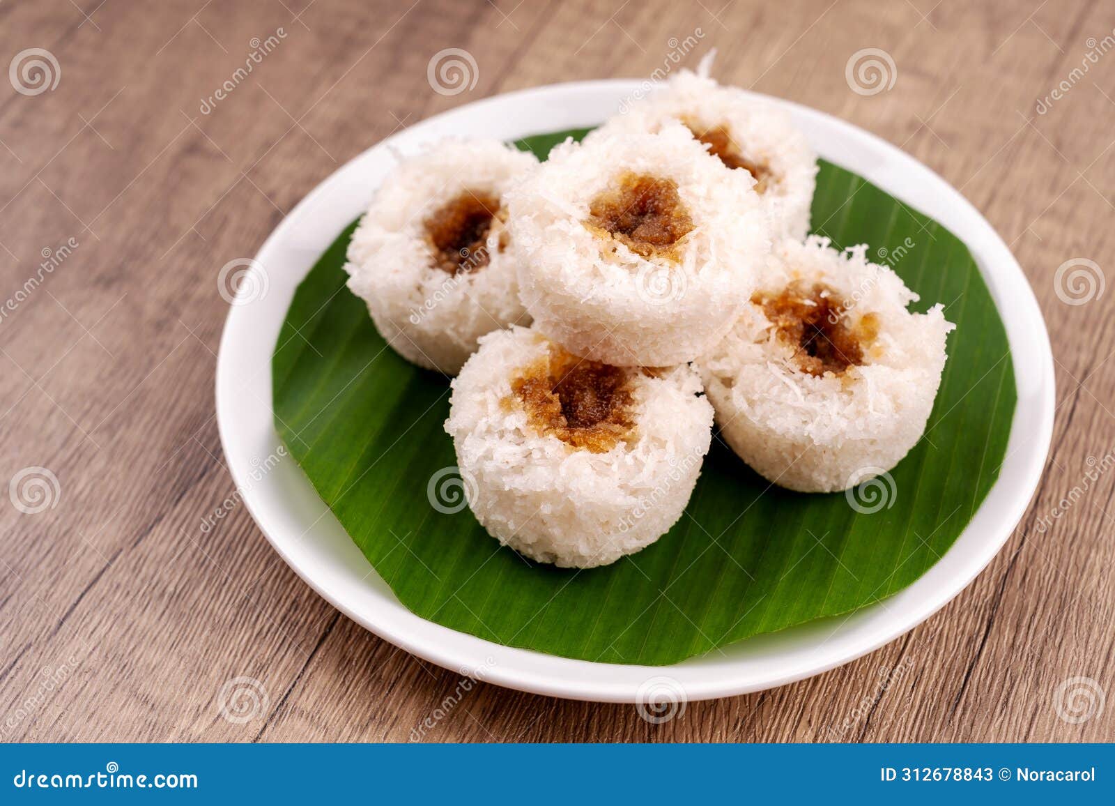 putu bambu or steamed rice flour cake with grated coconut and palm sugar filling