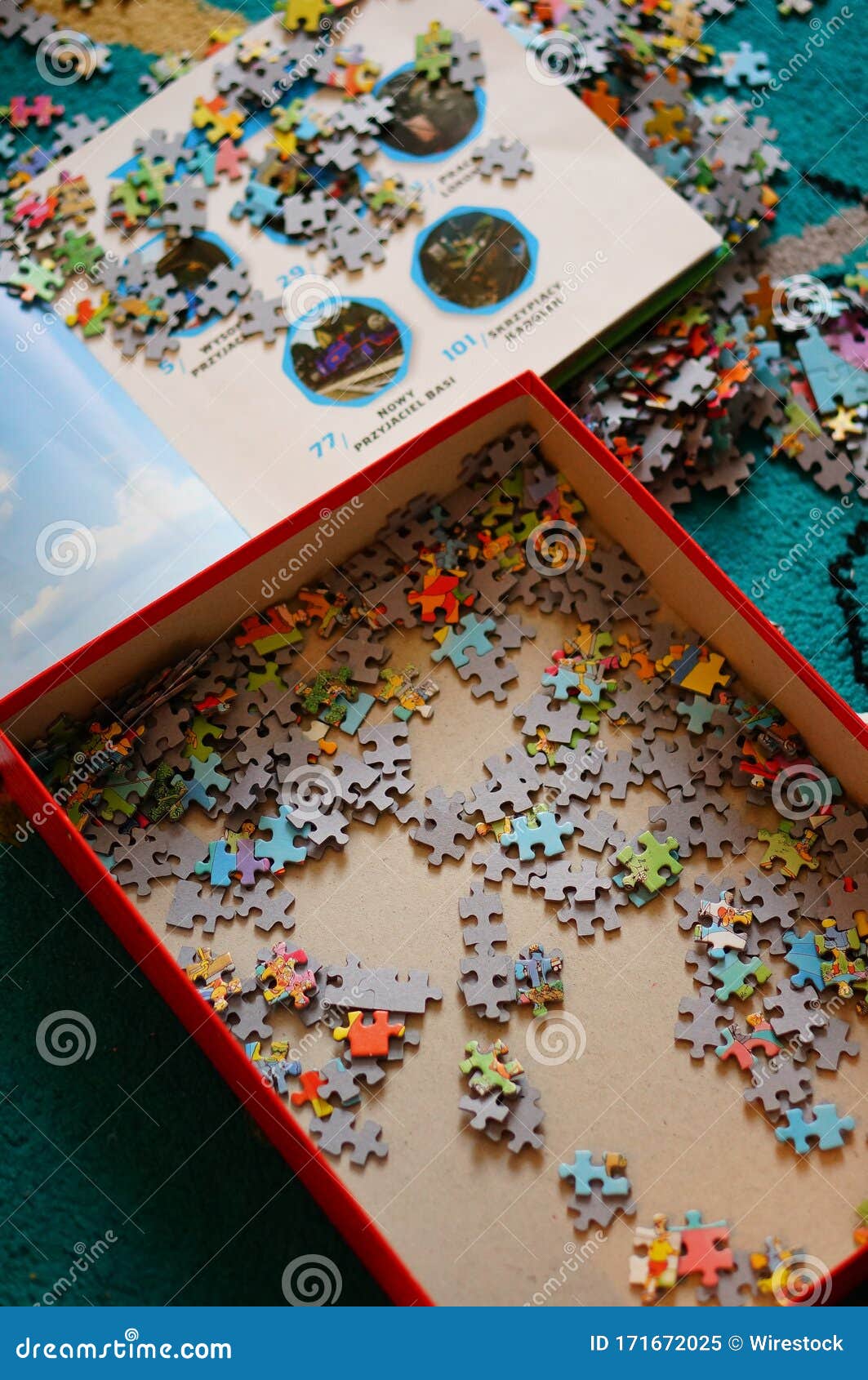 Puzzle pieces editorial image. Image of floor, book 171672025