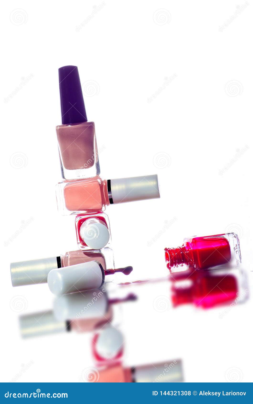 Pyramid of Bottles of Nail Polish in Different Colors. Open Inverted