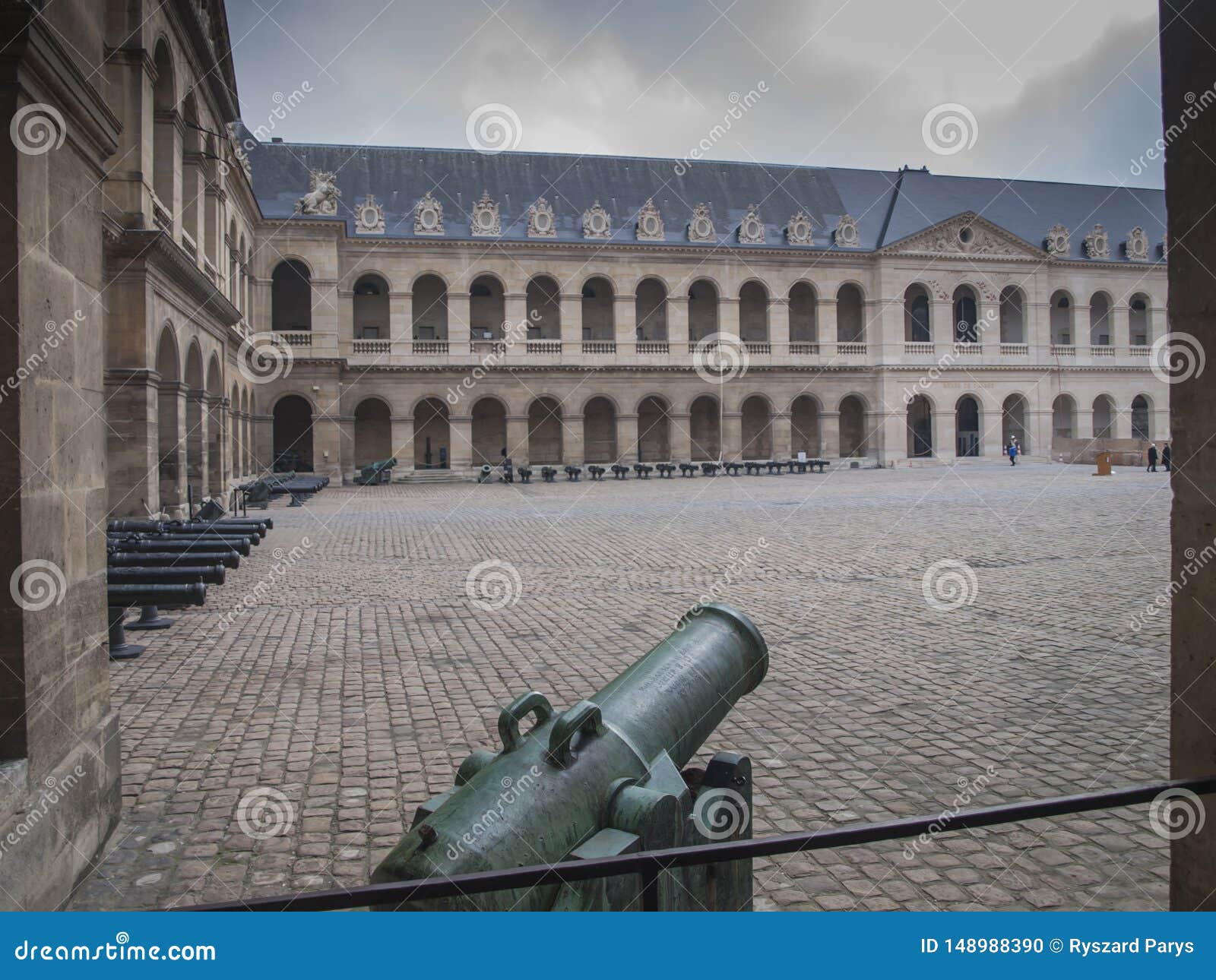 Inner courtyard of the palace Les Invalides with old cannons in Paris, which houses, inter alia, an army museum. France