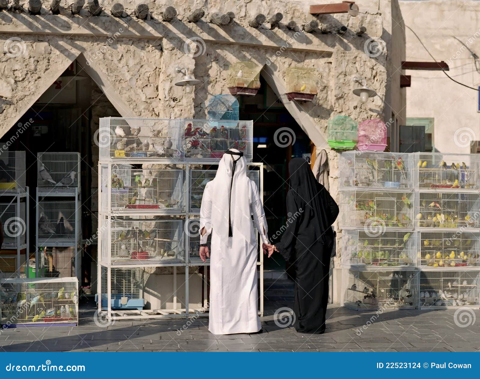 Qatar couple in pet market stock photo. Image of qatari 22523124