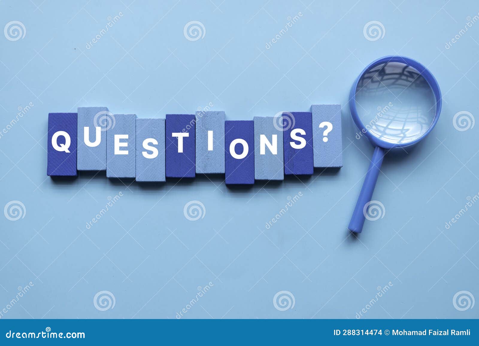 qna or questions and answers concept. blue magnifying glass with text over a blue background