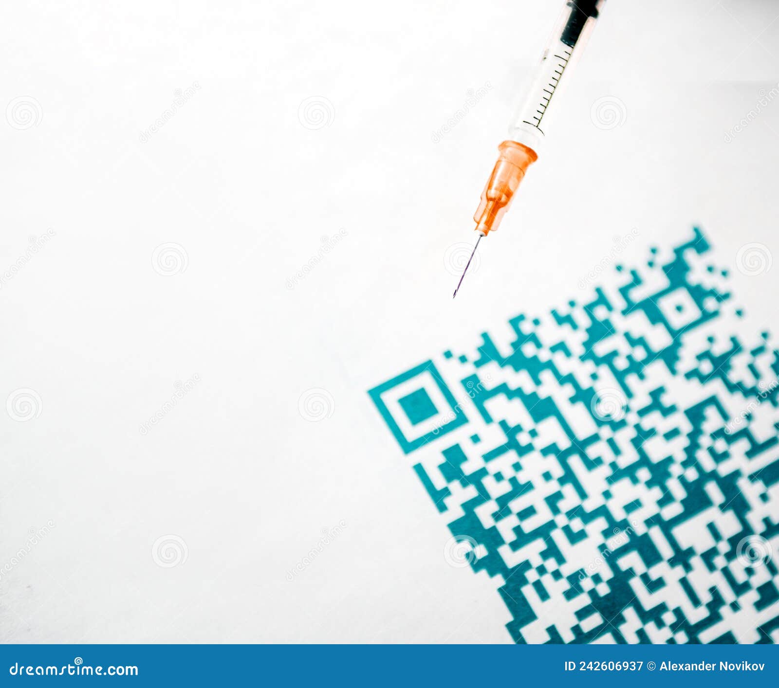 a qr code close up and medical syringe