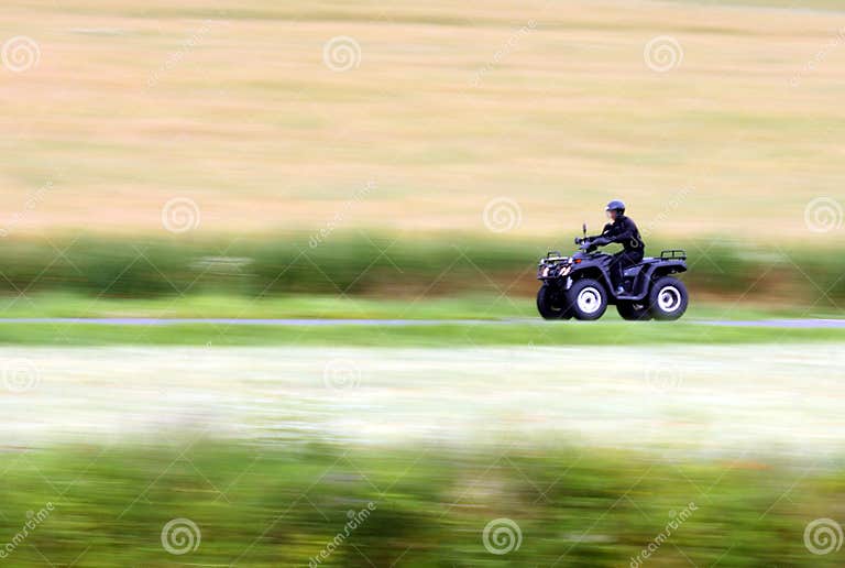 Quad bike and speed stock photo. Image of blured, green 28739146
